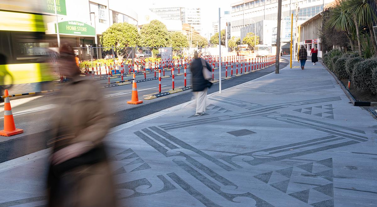 People walking on the pavement on Thorndon Quay