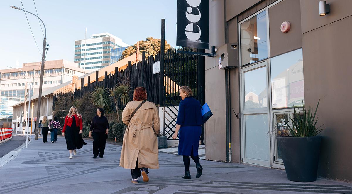 Women walking along the footpath on Thorndon Quay