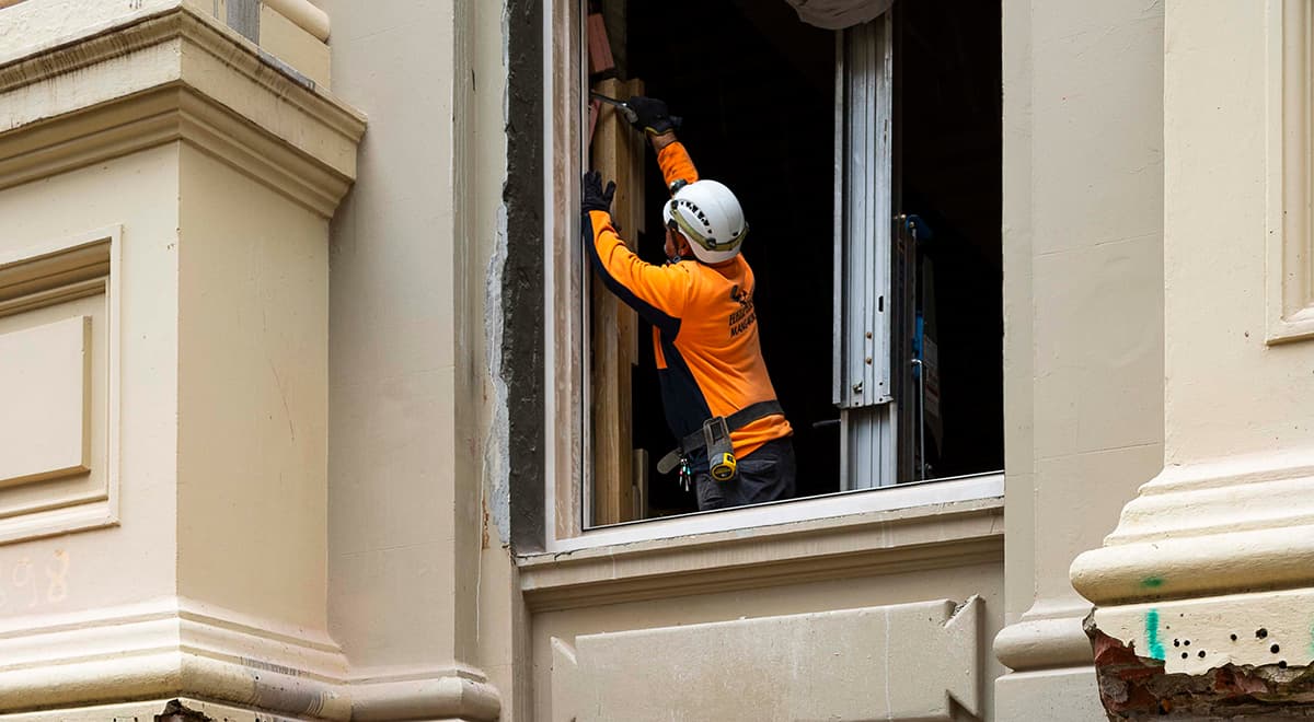 Worker doing building work on The Town Hall 